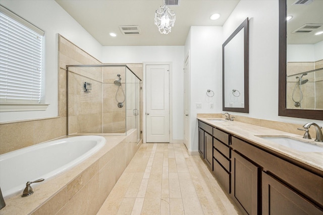 bathroom featuring hardwood / wood-style flooring, vanity, and plus walk in shower