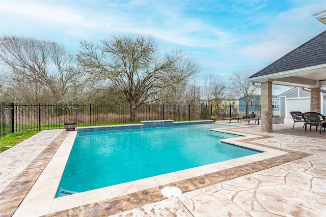 view of swimming pool featuring a patio area