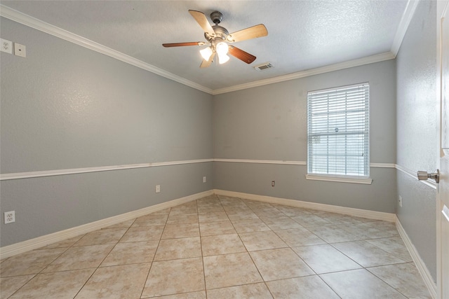 tiled spare room with ceiling fan, crown molding, and a textured ceiling