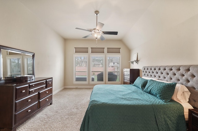 bedroom featuring lofted ceiling, light colored carpet, and ceiling fan