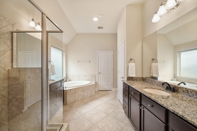 bathroom featuring tile patterned flooring, plus walk in shower, lofted ceiling, and vanity