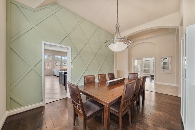 dining space with dark hardwood / wood-style flooring