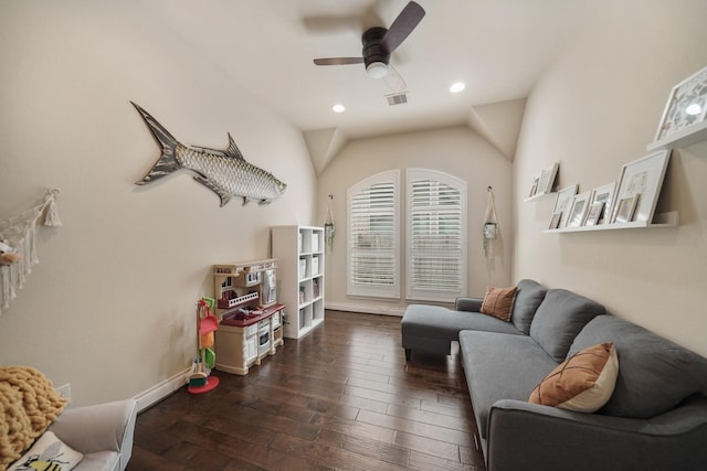 living room featuring vaulted ceiling, dark hardwood / wood-style floors, and ceiling fan