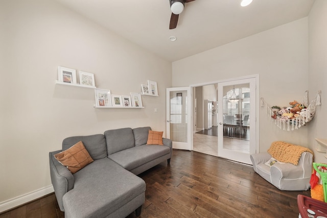 living room featuring dark hardwood / wood-style floors, ceiling fan, and french doors