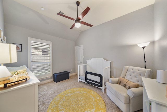 bedroom with ceiling fan, vaulted ceiling, and light carpet