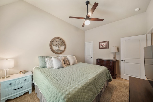 bedroom with vaulted ceiling, light colored carpet, and ceiling fan