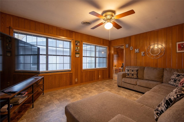 living room with wooden walls