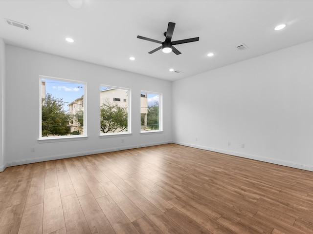 unfurnished room with light hardwood / wood-style flooring and ceiling fan