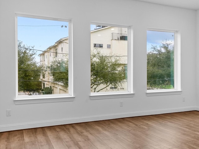 interior space with hardwood / wood-style flooring and a wealth of natural light