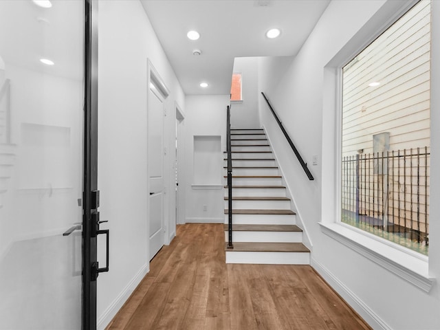 stairway featuring hardwood / wood-style floors