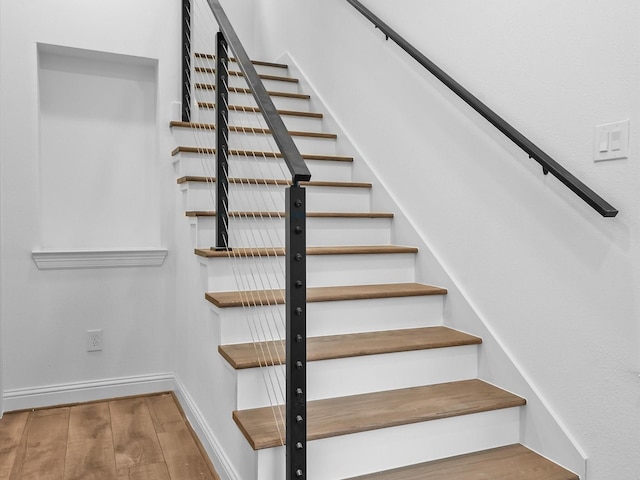 staircase featuring hardwood / wood-style flooring