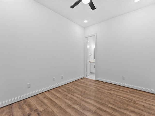 empty room featuring wood-type flooring and ceiling fan