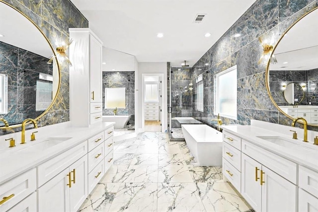 bathroom featuring vanity, separate shower and tub, plenty of natural light, and tile walls