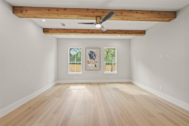 spare room featuring beam ceiling, ceiling fan, and light hardwood / wood-style floors