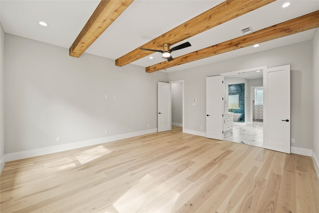 unfurnished bedroom with ensuite bathroom, beam ceiling, and light hardwood / wood-style floors