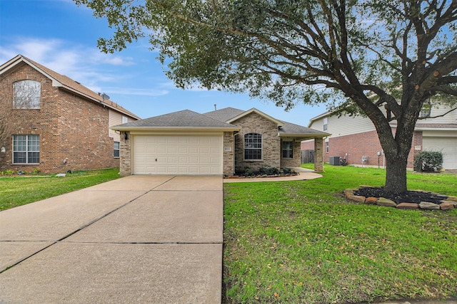 view of front of home featuring a garage and a front lawn