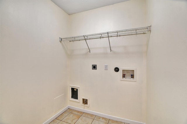 washroom with light tile patterned flooring, hookup for an electric dryer, and hookup for a washing machine