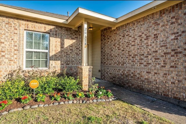 entrance to property with brick siding