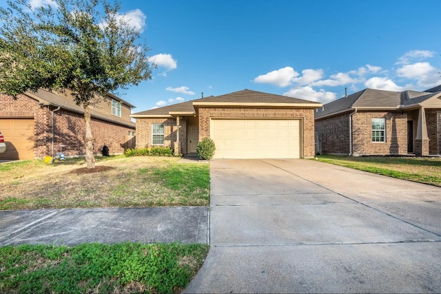 ranch-style home featuring a front yard, concrete driveway, brick siding, and an attached garage