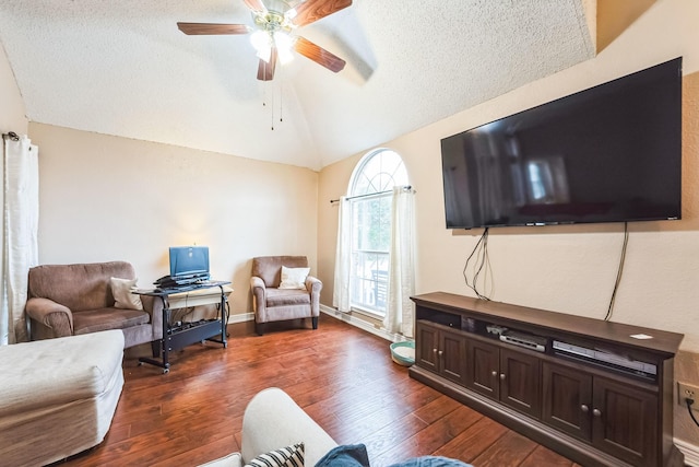 living room featuring dark wood-type flooring, ceiling fan, lofted ceiling, and a textured ceiling