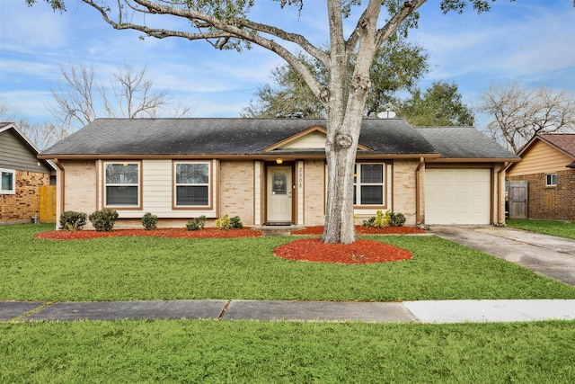 ranch-style house featuring a garage and a front yard