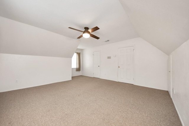 bonus room featuring vaulted ceiling, ceiling fan, and carpet