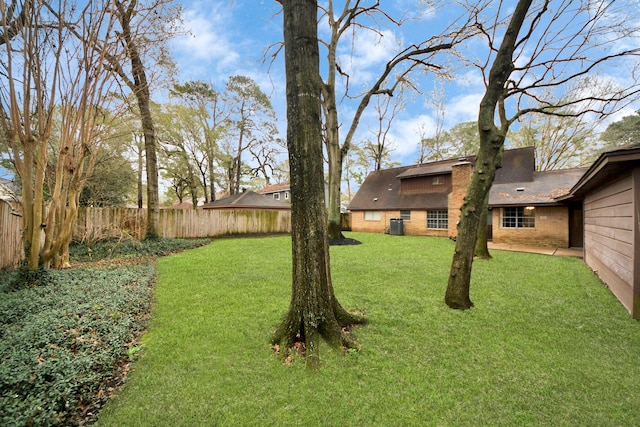 view of yard featuring central AC unit