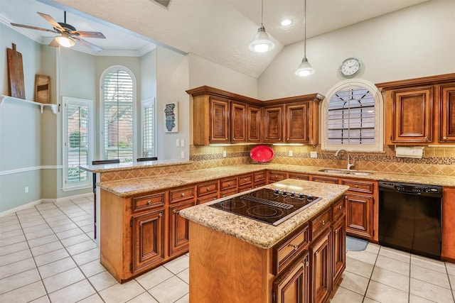 kitchen featuring sink, light tile patterned floors, hanging light fixtures, black appliances, and a kitchen island