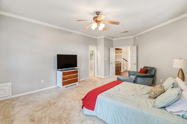 bedroom featuring light carpet, crown molding, ceiling fan, and ensuite bathroom