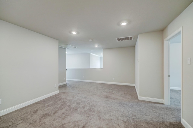 basement featuring light carpet