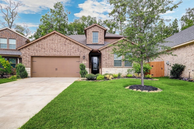 view of front facade featuring a garage and a front lawn