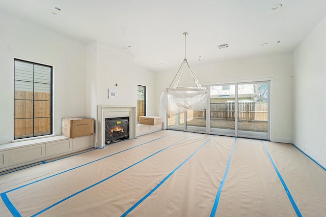 unfurnished living room with light carpet