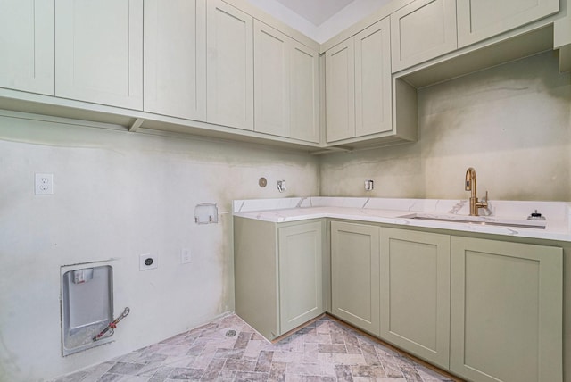 clothes washing area with cabinets, hookup for a washing machine, sink, and electric dryer hookup