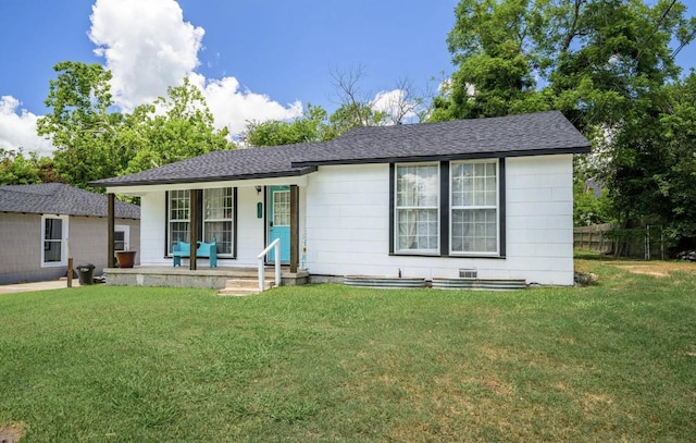 ranch-style house with covered porch and a front lawn