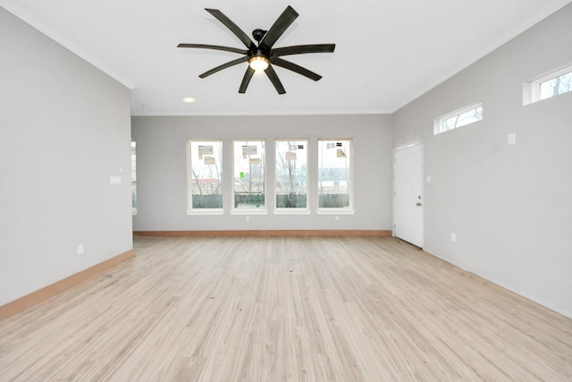 unfurnished living room featuring ceiling fan and light hardwood / wood-style flooring