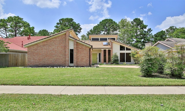 view of front of property with a front lawn