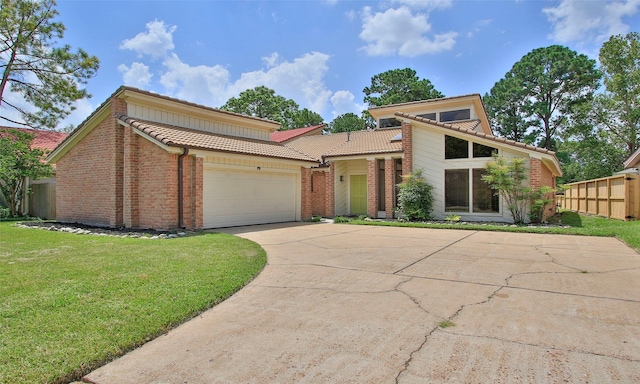 view of front facade with a garage and a front lawn