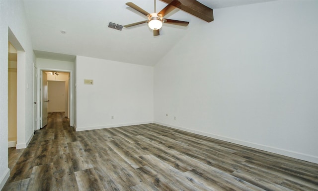 spare room with dark wood-type flooring, lofted ceiling with beams, and ceiling fan