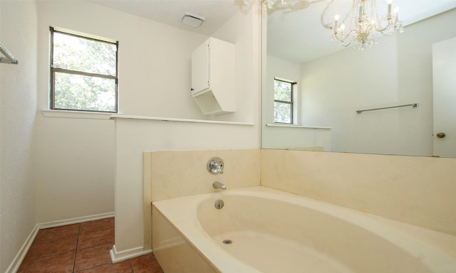 bathroom with plenty of natural light, a bath, and tile patterned floors