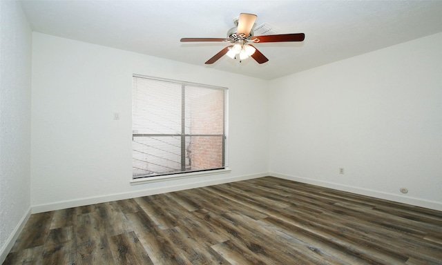 unfurnished room with dark wood-type flooring and ceiling fan