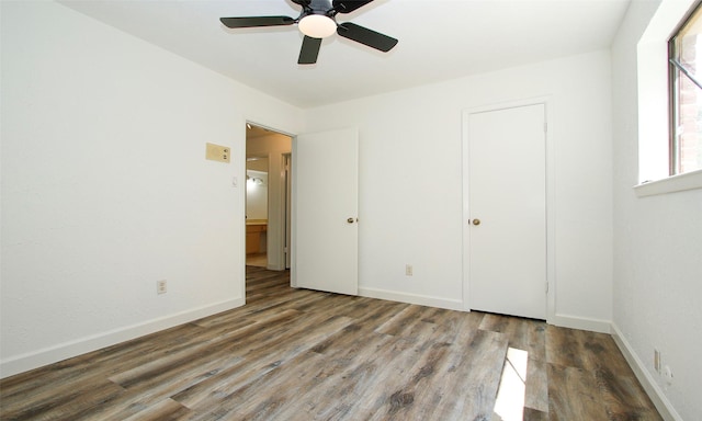 unfurnished bedroom with ceiling fan and hardwood / wood-style floors