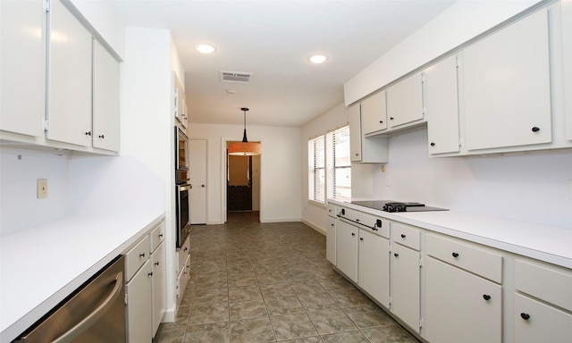 kitchen featuring stainless steel appliances, white cabinetry, pendant lighting, and light tile patterned flooring