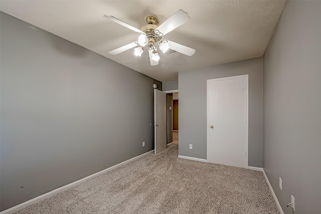 unfurnished bedroom featuring carpet and ceiling fan