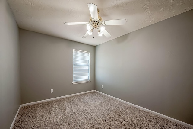 unfurnished room featuring a textured ceiling, carpet floors, and ceiling fan