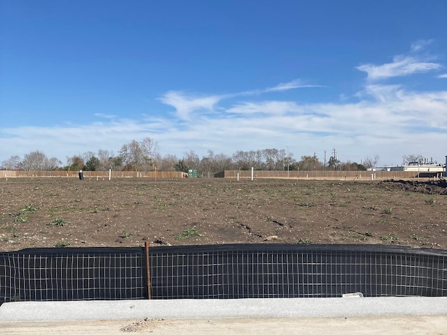 view of yard with a rural view