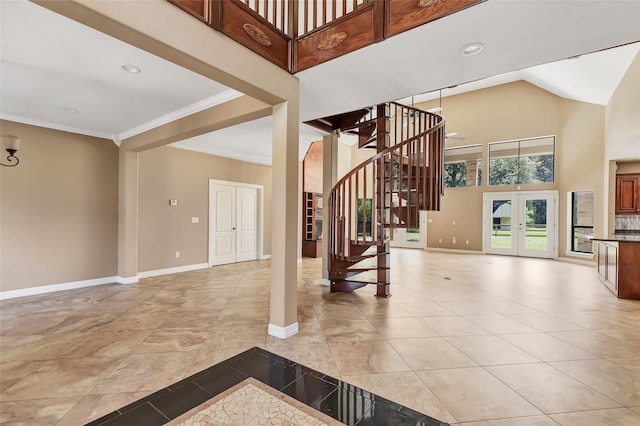 interior space featuring french doors, crown molding, high vaulted ceiling, and light tile patterned floors