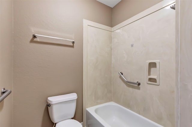 bathroom with bathing tub / shower combination and toilet