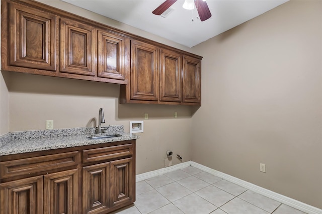 washroom featuring sink, cabinets, hookup for a gas dryer, washer hookup, and ceiling fan