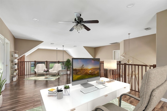 office space featuring hardwood / wood-style flooring and ceiling fan with notable chandelier