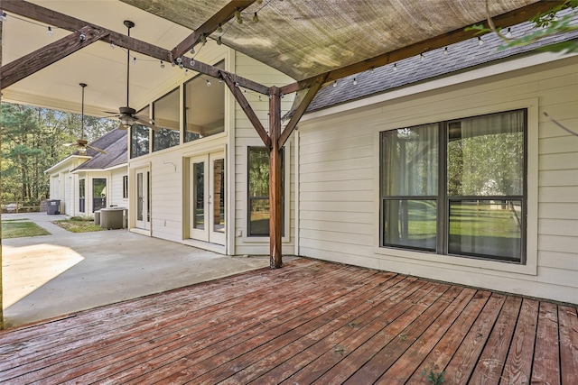 deck with cooling unit, a patio area, and ceiling fan